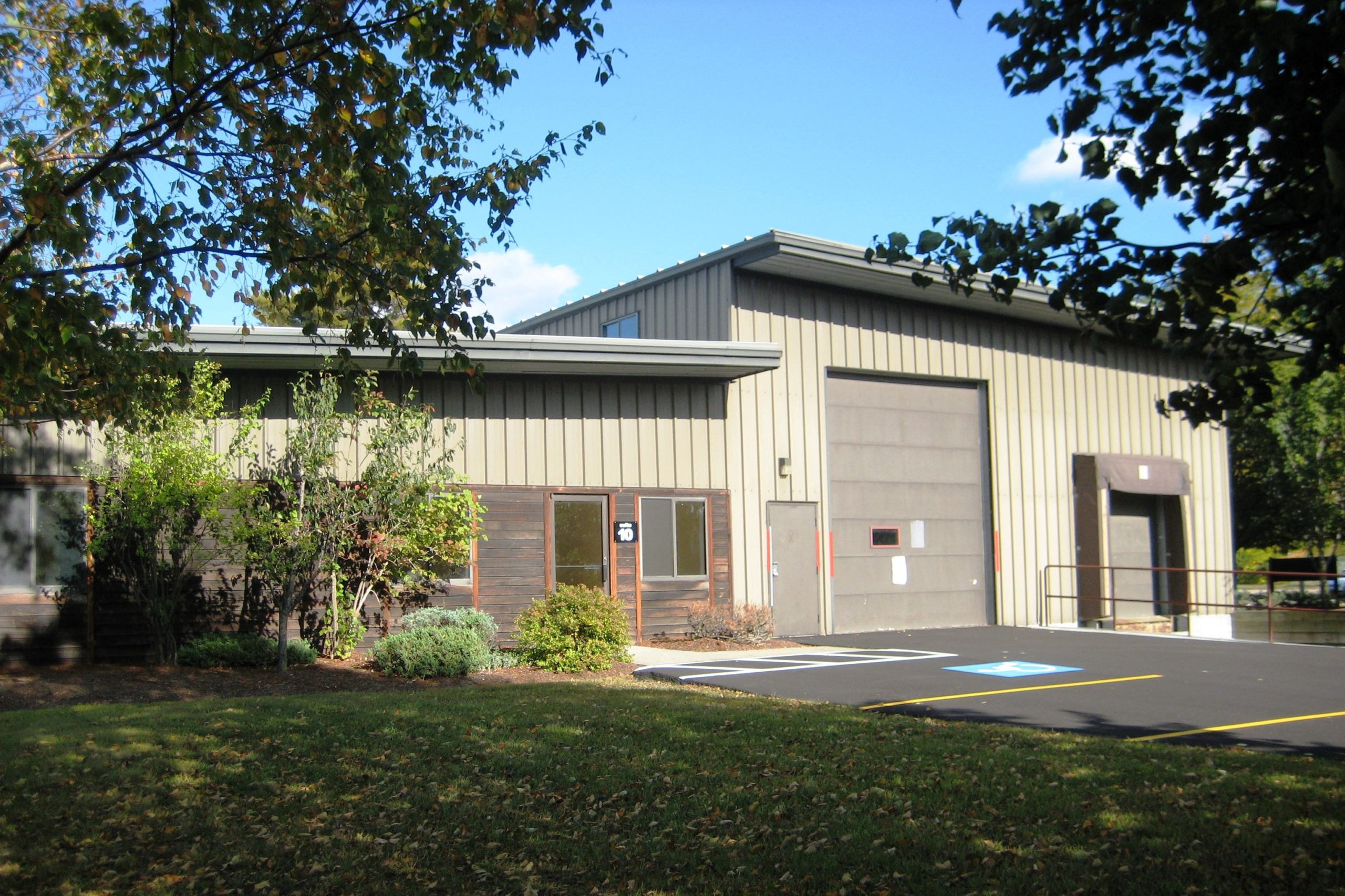 Exterior of building with garage and truck bay